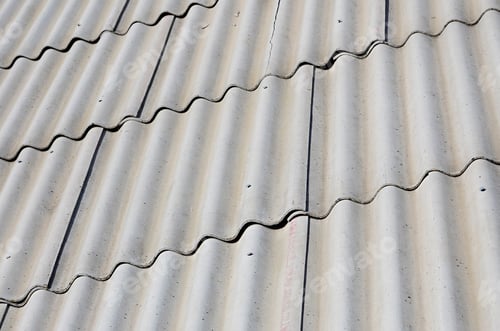 Preview: A fragment of a gray slate roof of an old sample made of asbestos material