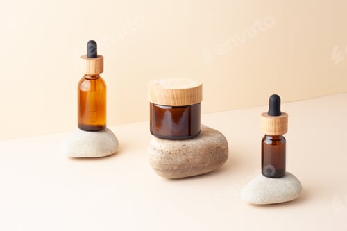 Preview: Cosmetic skin care products with stones on pastel beige background. Close up
