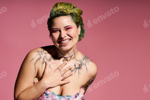 Preview: Vibrant young woman showcasing bold fashion and unique style against a soft pink backdrop