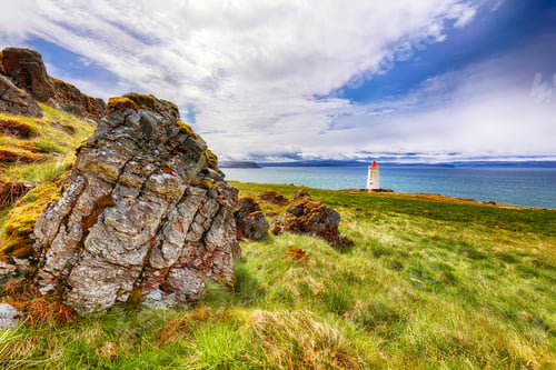 Preview: Stunning view of Skarsviti lighthouse in Vatnsnes peninsula on a clear day in North Iceland.