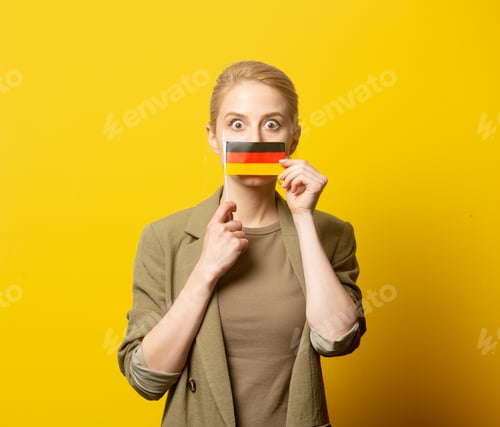 Preview: Style blonde woman in jacket with German flag on yellow background