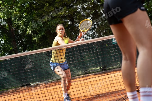 Preview: Two competitive female tennis players engage in an intense match.