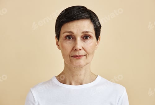 Preview: Candid portrait of adult woman looking at camera