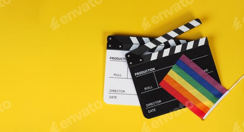 Preview: Two Clapper board and rainbow pride flag on yellow background.