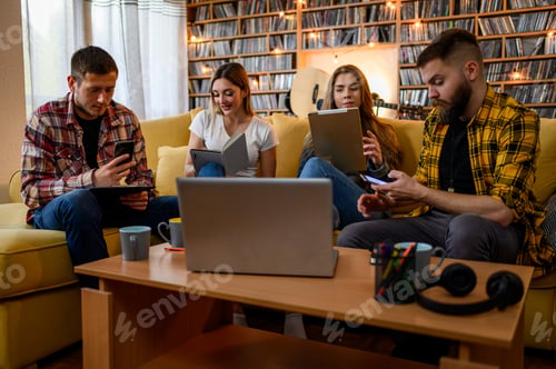 Preview: A group of young students using a digital tablet while studying for their exam