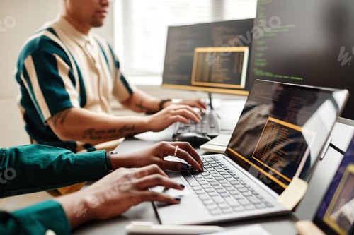 Preview: Software Developers Writing Code Closeup