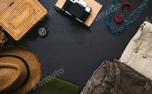Preview: ummer travel flat lay of traveller accessories set.cloth,hat,yellow wicker bag,camera and notebook