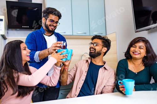 Preview: arabian men and women sitting in kitchen and discussing a news