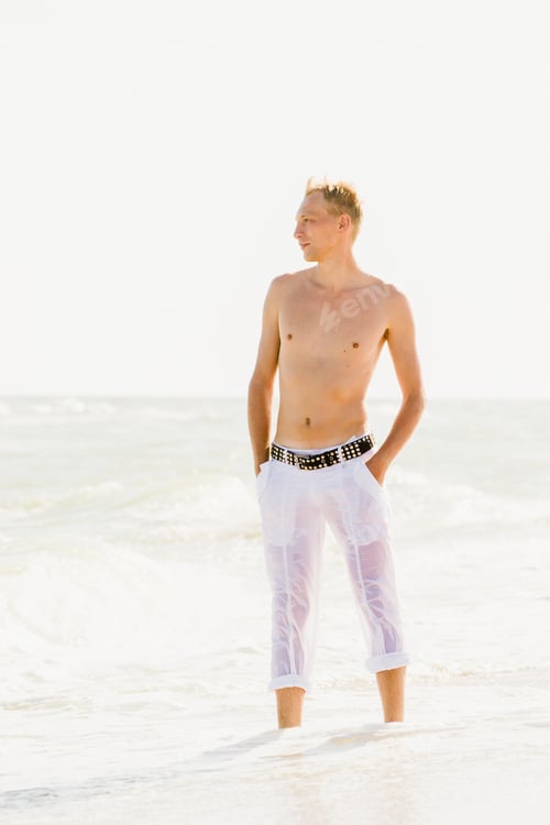 Preview: a man walking along the seashore