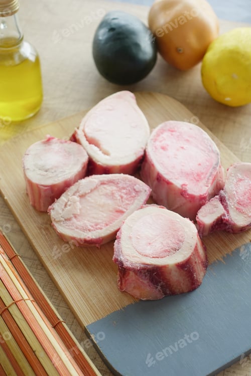 Preview: Close-Up of Fresh Bone Marrow Slices on Dark Surface