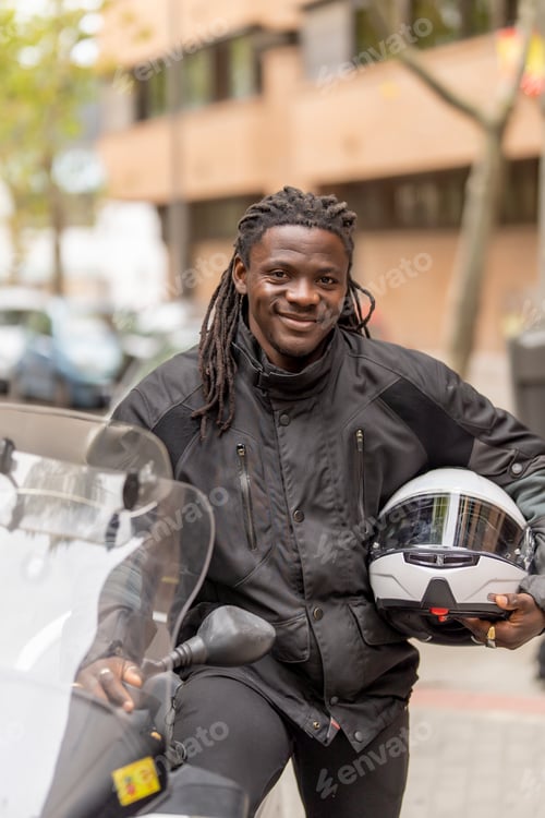 Preview: Man posing with helmet on motorcycle