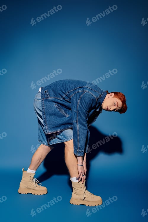 Preview: Emotional expression of a young and handsome man in a stylish outfit and boots