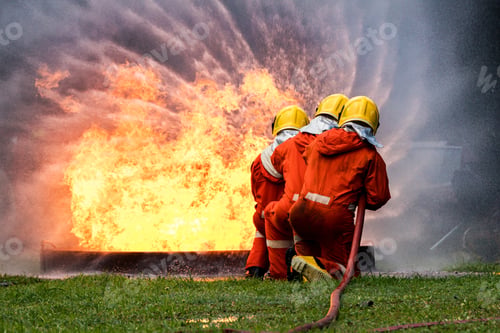 Preview: Firefighter Concept. Fireman using water and extinguisher to fighting with fire flame.