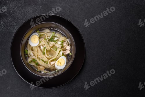 Preview: Fresh delicious hot puree soup in a black plate
