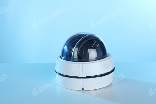 Preview: Modern security CCTV camera on color background