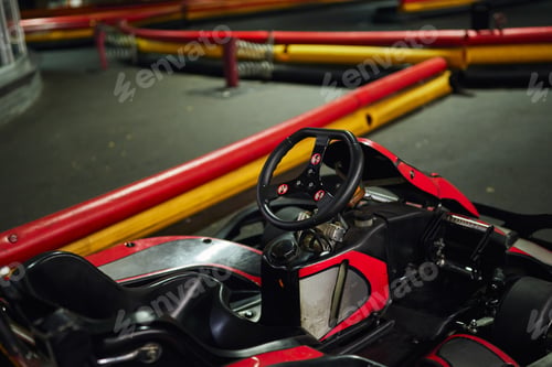 Preview: design of red racing car inside of indoor kart circuit, motor race vehicle, go cart, steering wheel
