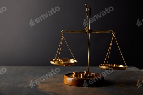 Preview: golden stones on scales on marble table and dark background