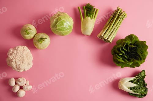 Preview: Flat lay of ripe green leafy vegetables containing much vitamins and nutrients. Mushrooms, broccoli,