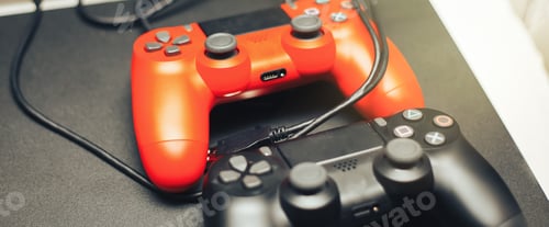 Preview: Computer game competition. Gaming concept. red and black joysticks on black background