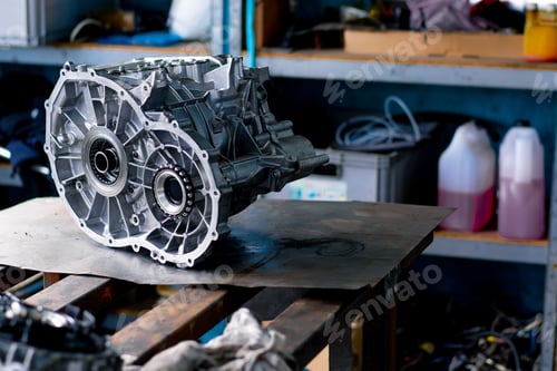 Preview: Close-up of parts of a clean engine block removed from a car for repair which lie on a table