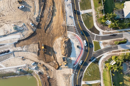 Preview: Roadworks construction site at roundabout intersection on American highway.