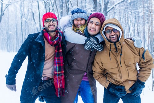 Preview: Outdoor lifestyle portrait of four best friends, smiling and having fun together