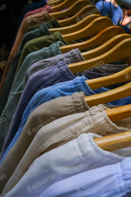 Preview: top view for Rack with stylish natural women's clothes in the market