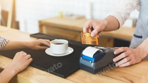 Preview: Credit card payment in cafe for morning coffee