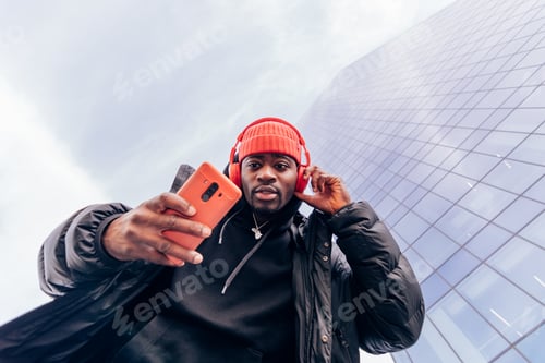 Preview: cool street style hypebeast hip hop rapper influencer recording music video using cell phone