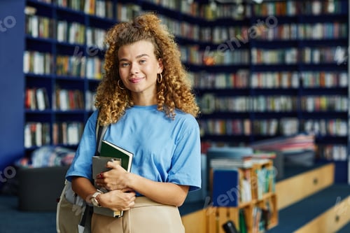 Preview: Smiling Young Woman in School Library
