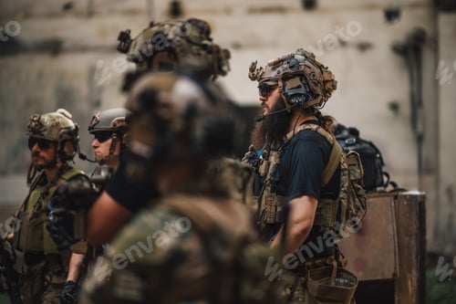Preview: Group of fully armed brave soldiers standing in demolished ruins.