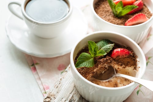 Preview: Tiramisu in the dessert bowl on the white table horizontal