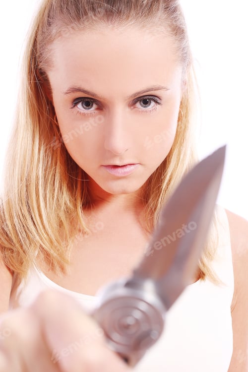 Preview: Woman Holding Knife with Intense Expression, Close Up