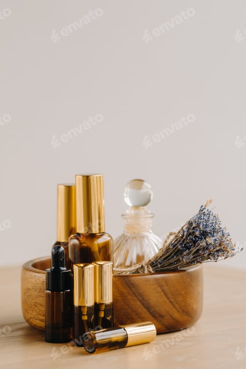 Preview: Essential oil in bottles with lavender fragrance, lying on a wooden surface