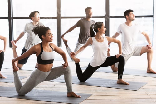 Preview: Yoga practice. Group of young people doing Mermaid pose