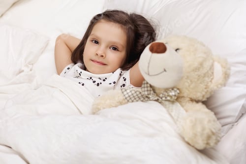 Preview: cute little child girl wakes up from sleep