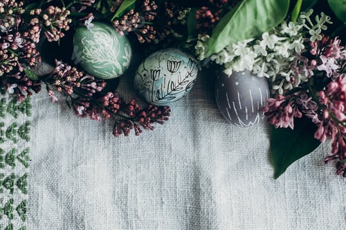 Preview: easter eggs with floral and chick ornaments on rustic background with lilac flowers