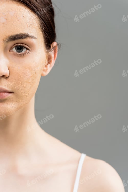 Preview: cropped view of brunette young woman with face scrub on skin