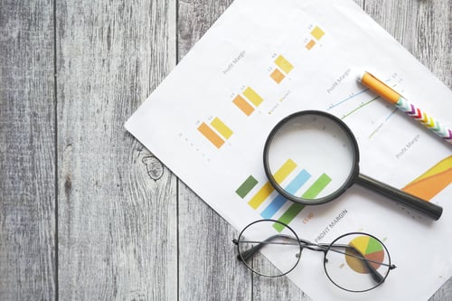 Preview: financial graph, calculator and notepad on table