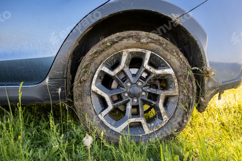 Preview: Close up of dirty off road car wheels with dirty tires covered with yellow mud