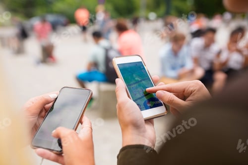 Preview: People playing augmented reality game with mobile phones