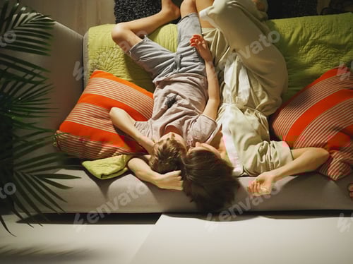 Preview: Mom and son on the couch are watching television