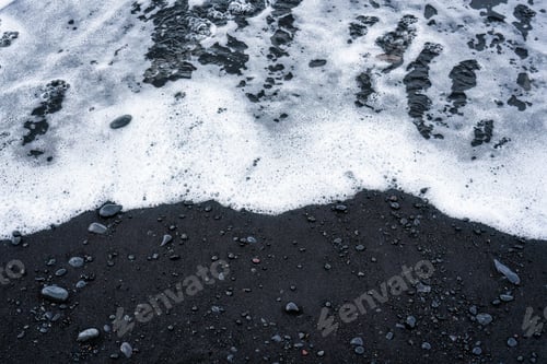 Preview: Sea wave on volcanic black sand beach in summer