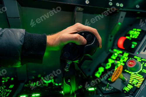 Preview: cockpit of a military plane a pilot with a steering wheel and many buttons on the control panel