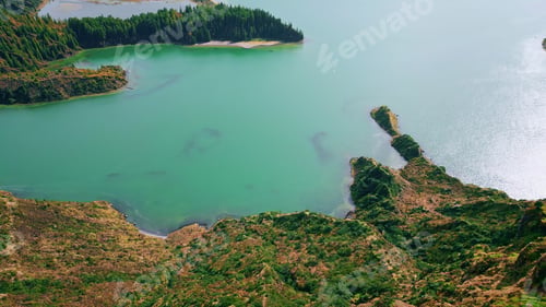 Preview: Volcanic island lagoon drone view. Rippling turquoise ocean washing rocky coast.