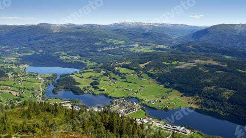 Preview: Aerial shot of Vossevangen municipality surrounded by greenery-covered mountains in Norway