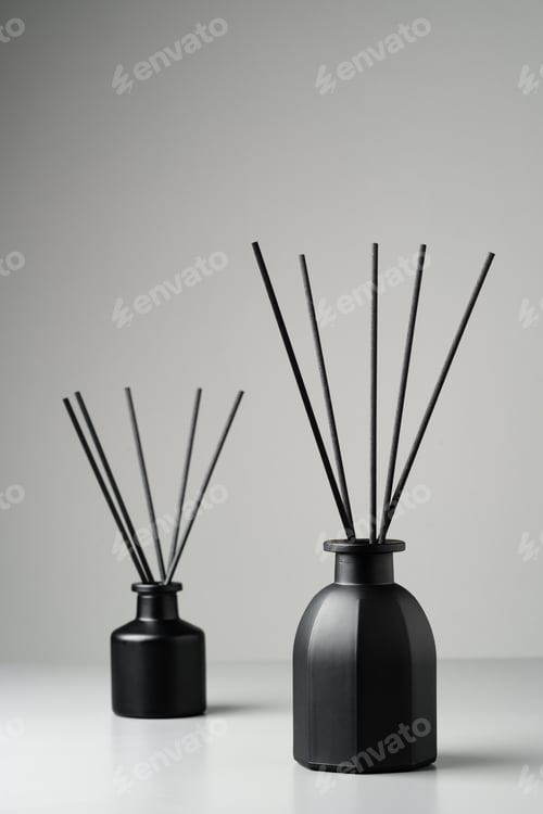 Preview: Two Black Reed Diffuser Bottles on a White Surface With Grey Background