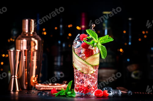 Preview: Rose garden cocktail drink with dry gin, tonic, syrup, juice, lemon, raspberry, cucumber
