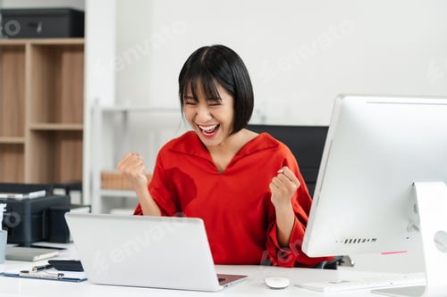 Preview: Successful business woman, excited young woman Keeping up arms and showing positive emotions