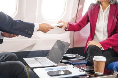 Preview: A businessman, an adult man, and a woman are meeting talking aboard an airplane. They hold hands,